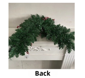Detail of the back structure of Christmas pine needle garland with red berries