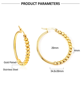 Detailed view of 35mm gold plated stainless steel earrings with beaded and smooth texture