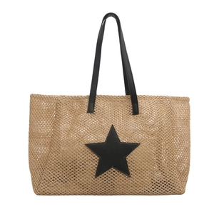 Handwoven straw tote bag for women featuring a large black star patch and leather straps