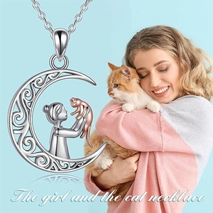 Detail of S925 silver moon and cat necklace with rose gold accents on the girl pendant