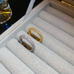 Detailed macro view of gold and silver plated twist rings with pavé cubic zirconia