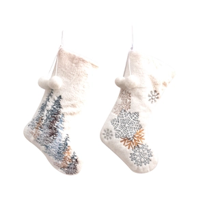 White plush Christmas stockings featuring embroidered forest scene and snowflake patterns