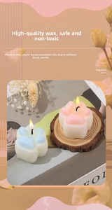 Detail of pink and blue cat paw shaped soy wax scented candles with clear textures