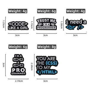 Detail of programmer-themed enamel pins featuring HTML code and keyboard shortcut designs