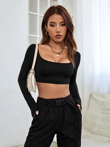 Detailed view of black high-elastic cropped long sleeve knit top with cargo pants