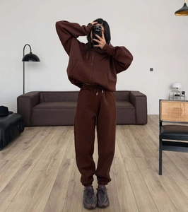 Detail of chocolate brown fleece hoodie and joggers set with drawstring waist and pockets