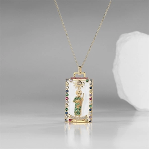 Detailed macro of gold tarot pendant necklace with micro-pave zircons and enamel art