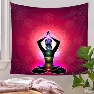 Detail of yoga meditation tapestry with 7 chakras and radiant mandala pattern on the wall