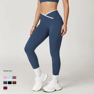 Marineblauwe yoga legging met hoge taille en witte crossover band voor sport en fitness