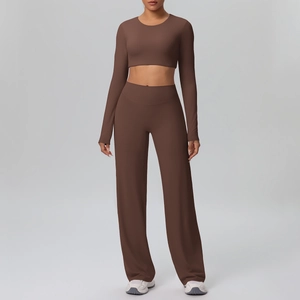 Detail of high-waist wide-leg yoga pants and long sleeve crop top in chocolate brown