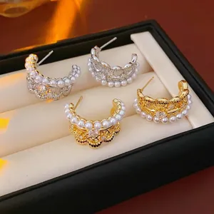French vintage silver needle C-shaped pearl earrings with gold and silver hollow lace design