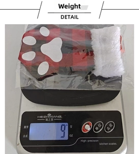Detailed view of lightweight red plaid cat paw Christmas stocking weighing 9 grams