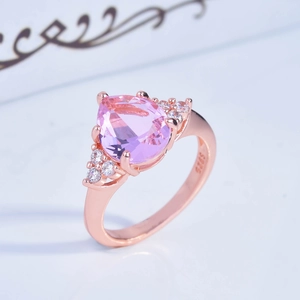 Rose gold 925 silver ring featuring a pink pear-shaped stone and side accents