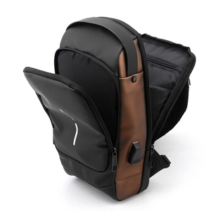 Detail of waterproof chest bag with multiple zip compartments and external USB charging port