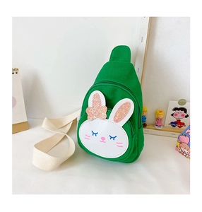 Detail of green canvas bunny crossbody bag with cute sequin bow and adjustable strap