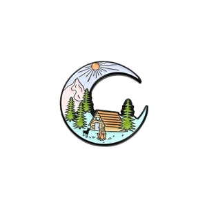 Outdoor camping enamel pin featuring a crescent moon with forest and campfire design