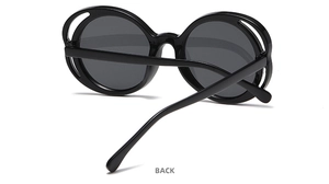 Rear view of oval sunglasses showing hinge detail and black glossy plastic frame
