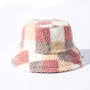 Detailed close-up showing the soft plush texture of the pink checkered sherpa bucket hat