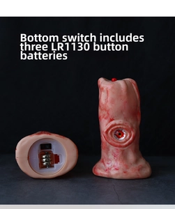 Detail view of bloody eyeball lamp with bottom battery compartment and power switch