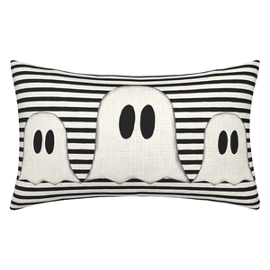 Detail of Halloween lumbar pillow cover with black and white stripes and ghost appliques