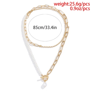 Detail of layered gold beaded chain with OT toggle clasp and pearl drop pendant