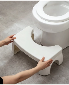 U-shaped thickened plastic bathroom stool with non-slip surface in a bright bathroom