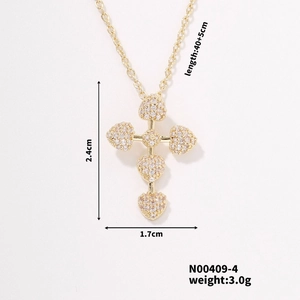 Detailed view of a gold cross necklace with five pavé heart charms and measurements