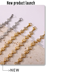 Detailed view of four-leaf clover bracelets with handset cubic zirconia in gold and silver