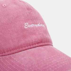 Close-up of Everyday white embroidery on washed cotton rose pink baseball cap