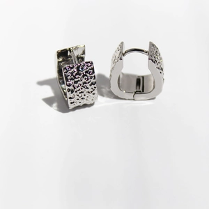Polished silver hammered texture trapezoid hoop earrings on a clean white background