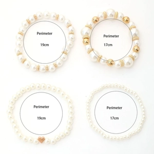 Detail showing perimeter measurements for faux pearl and heart charm beaded bracelets