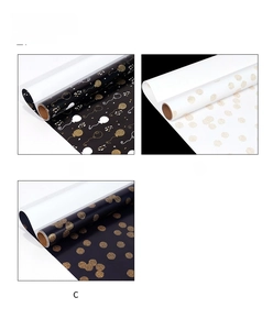 Three gift wrapping paper designs featuring gold balloons and dots on black and white rolls