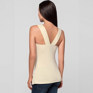 Elegant apricot sleeveless top with V-shaped back straps and soft knit texture for women