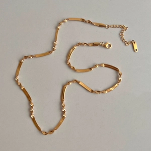 Gouden roestvrijstalen gedraaide slangenketting met karabijnsluiting en verlenging