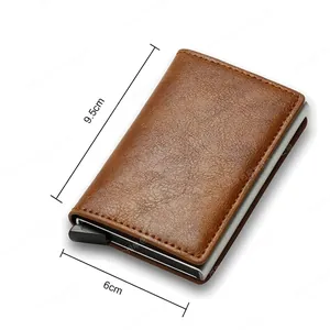 Brown leather RFID blocking card holder with automatic pop-up metal mechanism