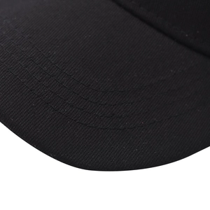 Detail view of high-density stitching and premium cotton twill on black baseball cap