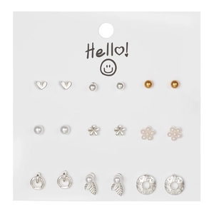 Detailed set of 9 pairs of gold and silver geometric stud earrings on a white card
