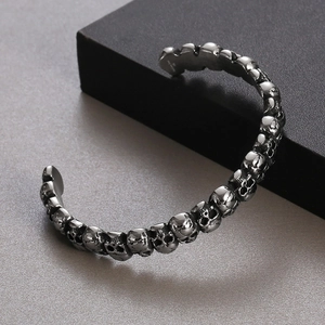 Close-up of gothic skull cuff bracelet in antique silver finish with 3D relief details