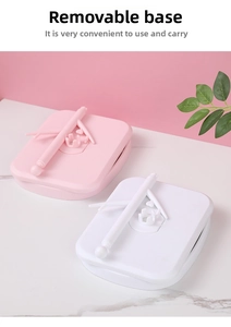 Close-up of detachable foldable base for desktop makeup mirror in pink and white ABS
