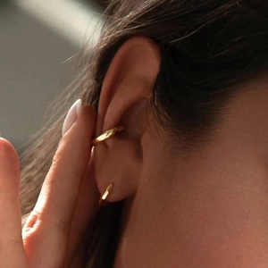 Minimalist S925 sterling silver gold earrings and ear cuff on model's ear