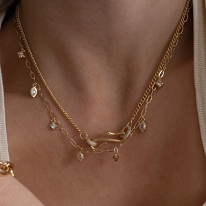 Vintage gold layered snake chain necklace featuring marquise and square zircon pendants