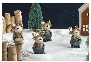 Detailed view of four resin Christmas reindeer figurines in a snowy winter scene