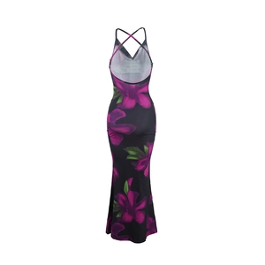 Detail of the backless floral maxi dress featuring elegant crisscross shoulder straps