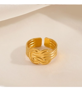 Macro shot of 18K gold plated adjustable rope knot ring with elegant woven texture