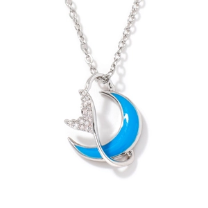 Silver necklace featuring a blue enamel crescent moon and sparkling zircon fish tail pendant