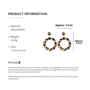 Detailed view of leopard print faux leather hoop earrings with size measurements