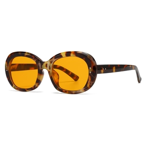 Retro oval sunglasses with tortoise frame, orange lenses and silver stud details