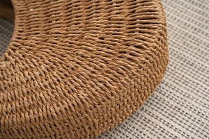 Macro detail of brown handwoven straw texture showing intricate craftsmanship