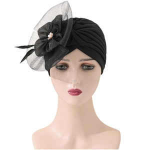 Elegant black turban hat with mesh flower, feathers and pearls for evening parties