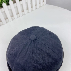 Top view of retro dark gray docker hat showing multi-panel cotton fabric construction
